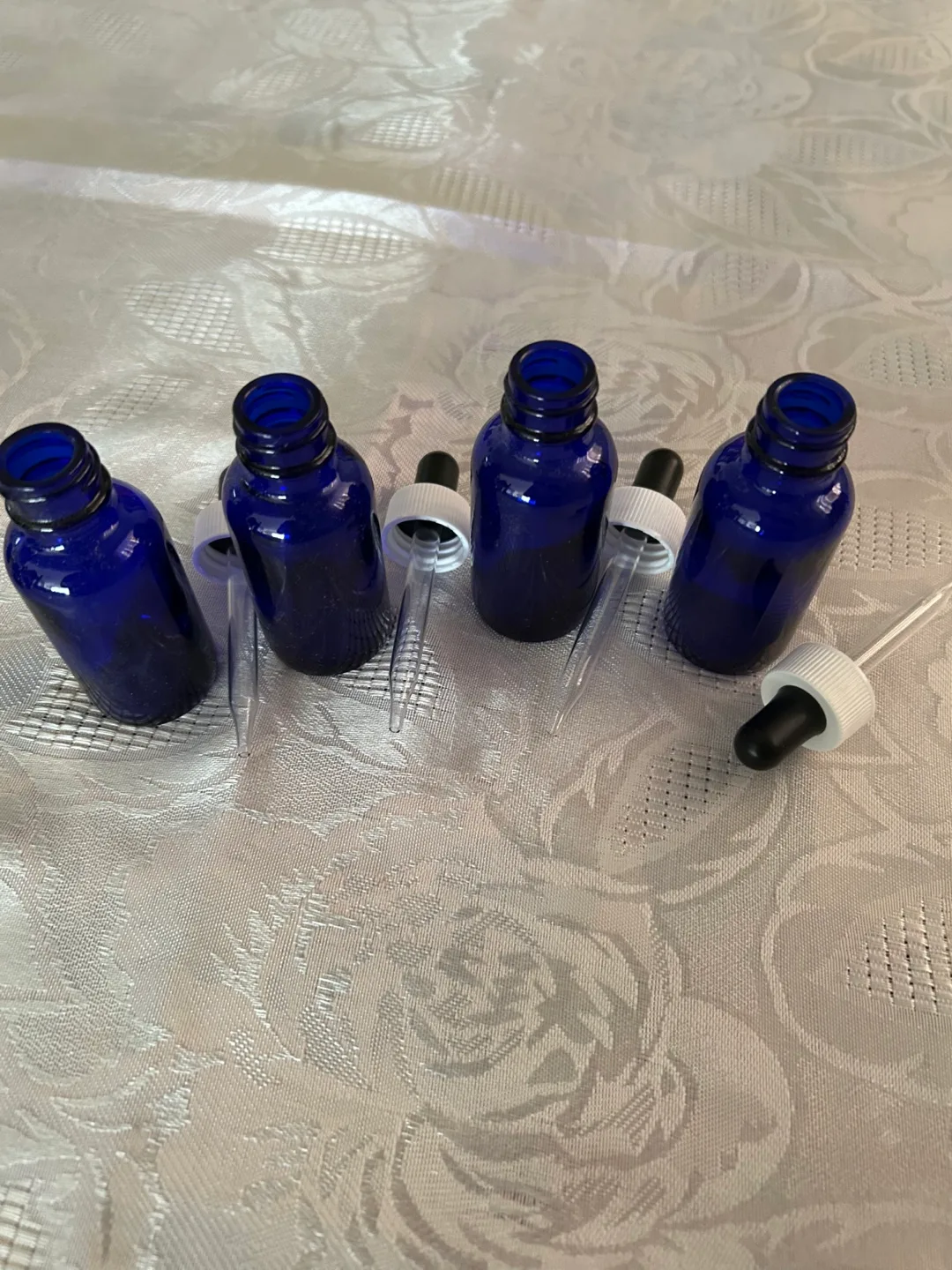 Eight cobalt blue glass bottles with droppers image indicator(5)