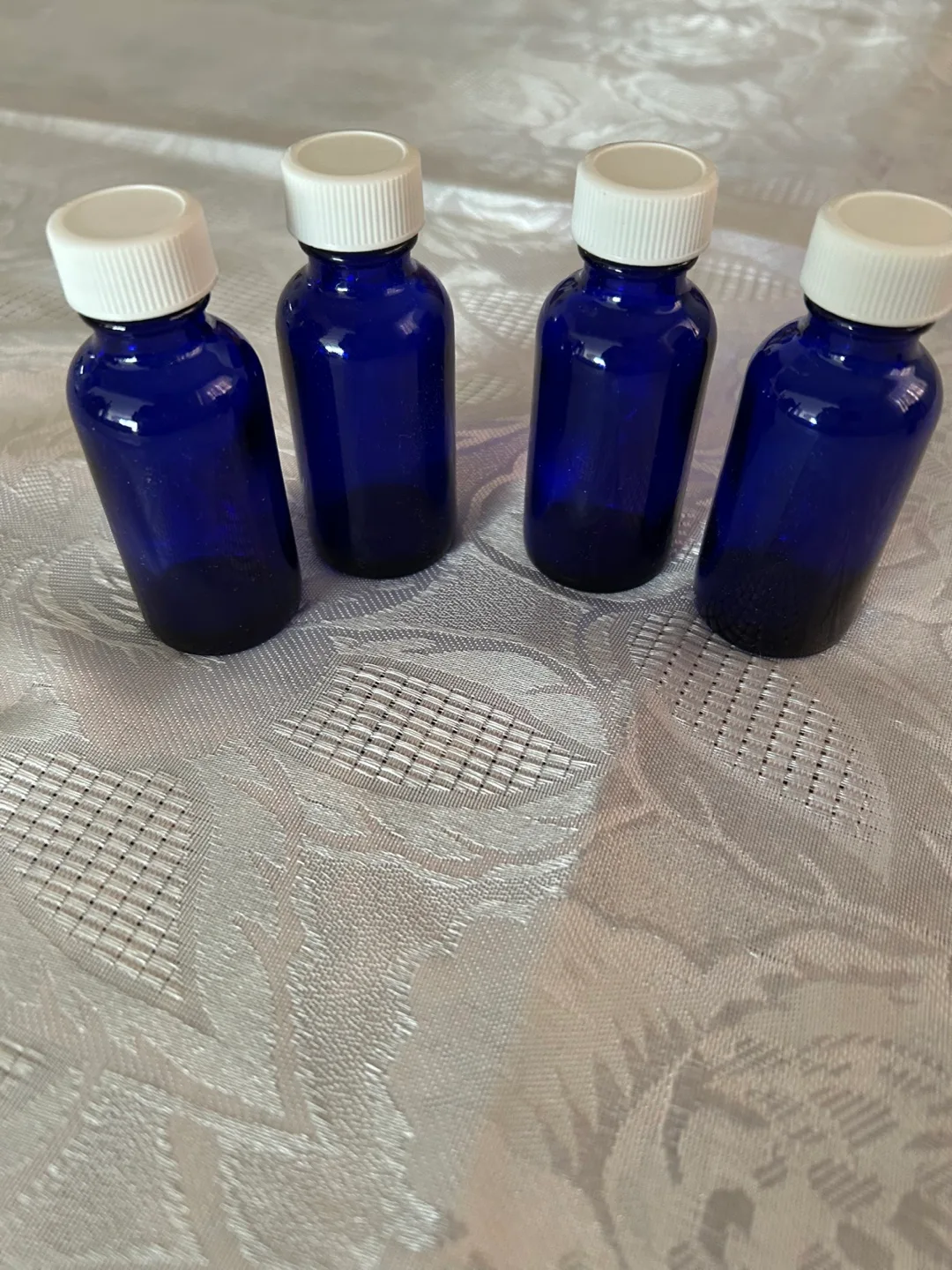 Eight cobalt blue glass bottles with droppers image indicator(3)