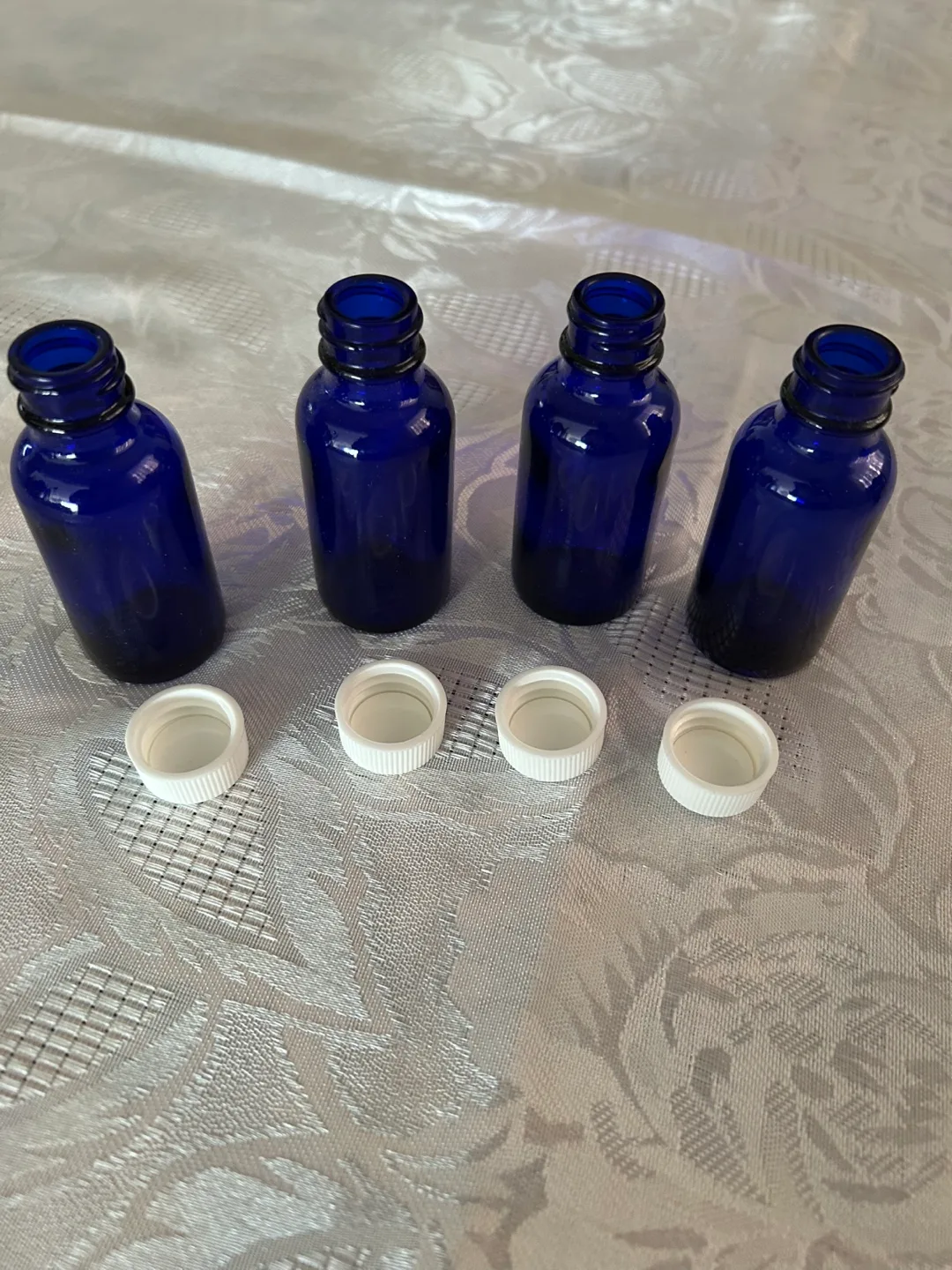 Eight cobalt blue glass bottles with droppers image indicator(4)