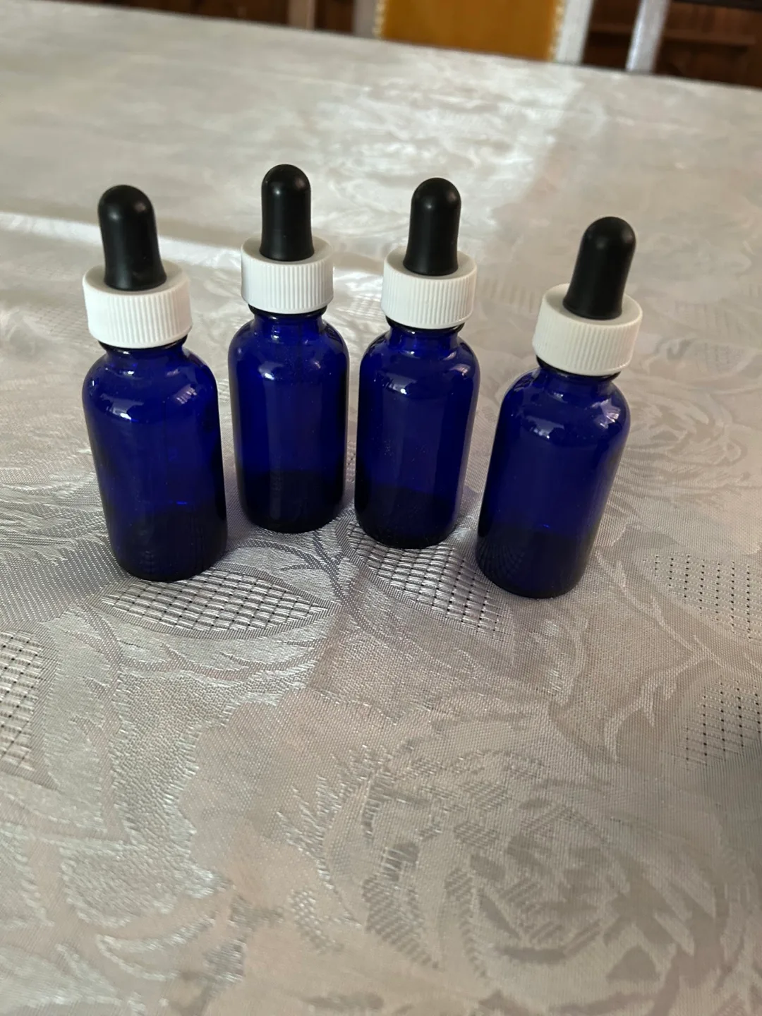 Eight cobalt blue glass bottles with droppers image indicator(2)