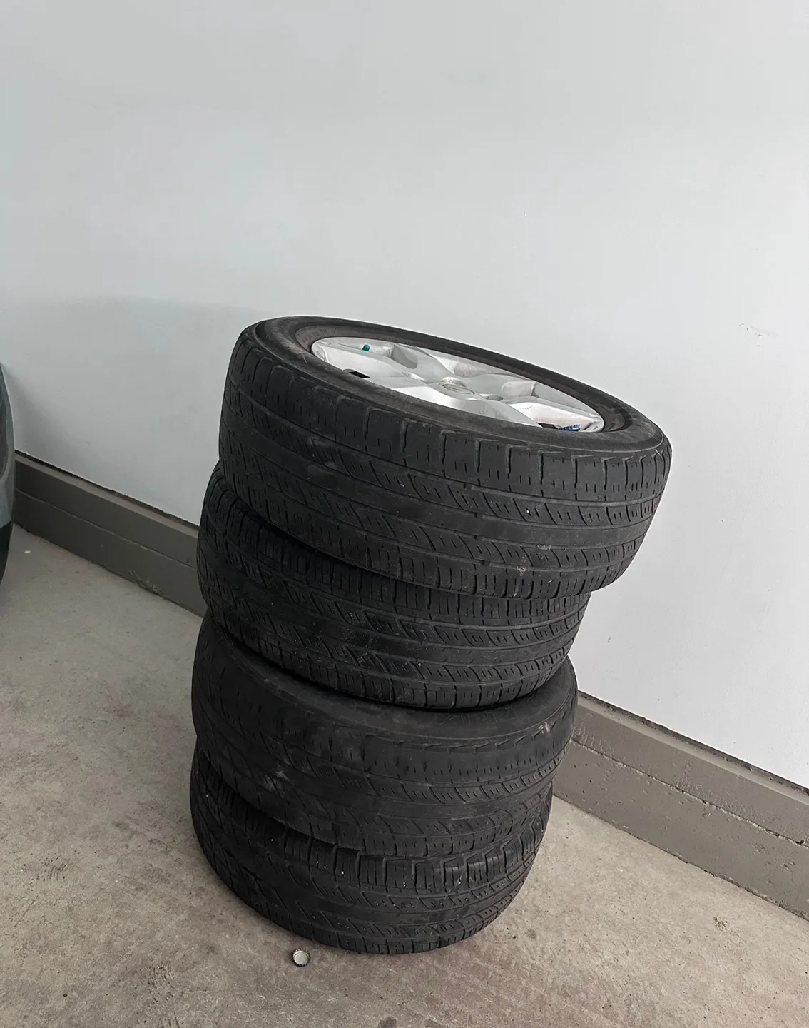 Set of four Nissan alloy rims with tires thumbnail