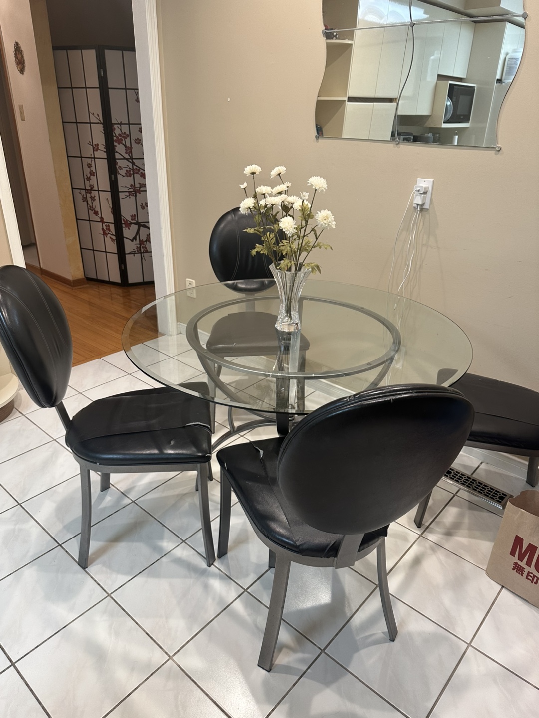 Glass top dining table with four chairs