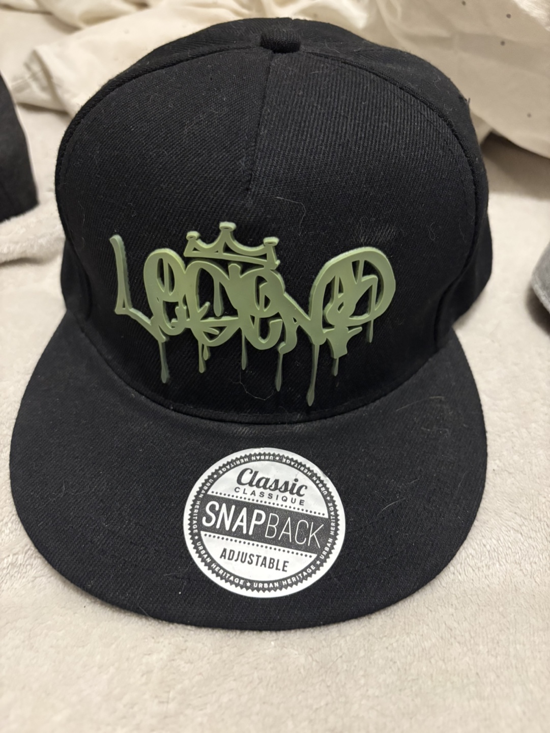 Black Snapback Hat with Green Logo