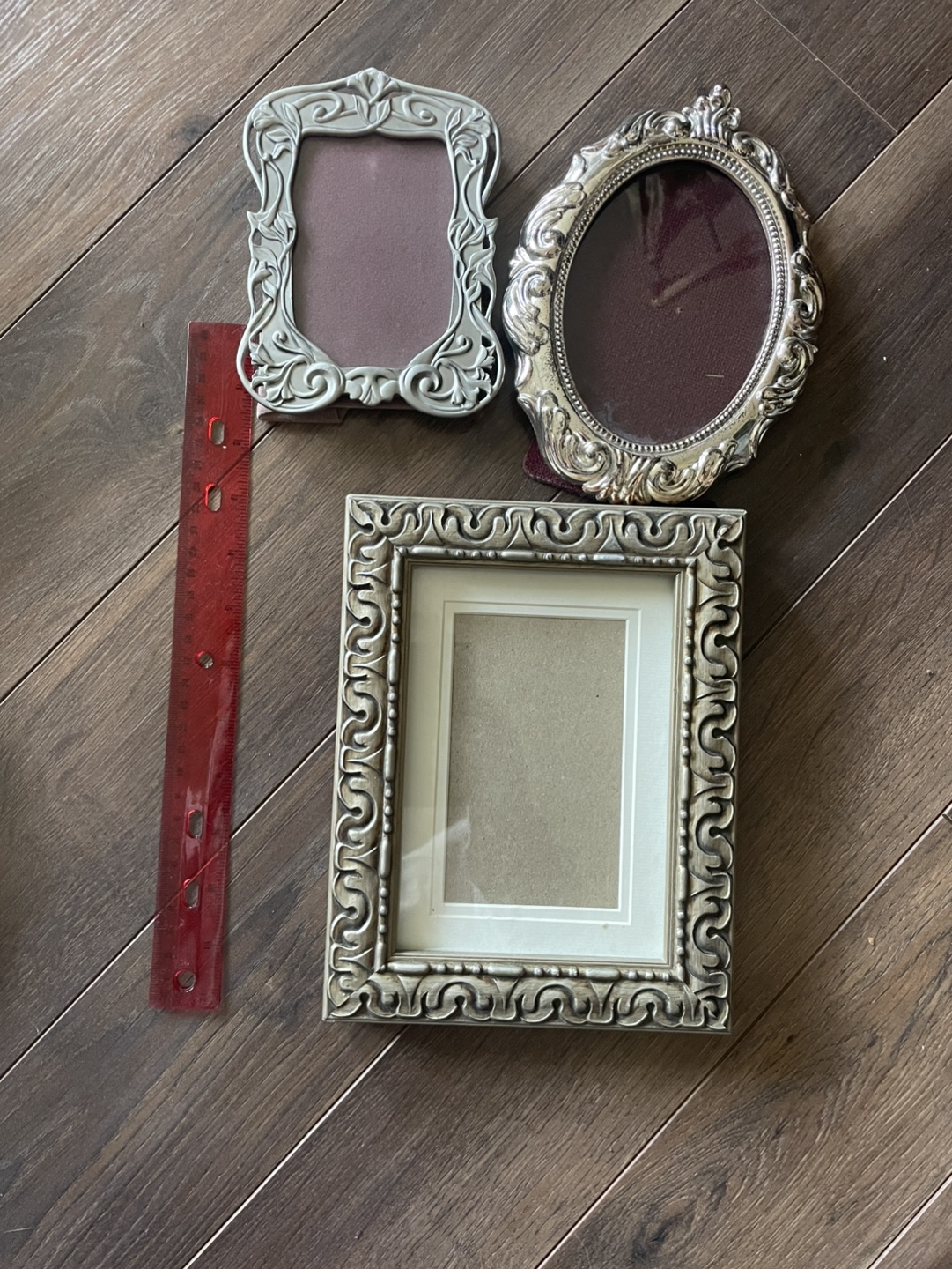 Set of three ornate silver picture frames
