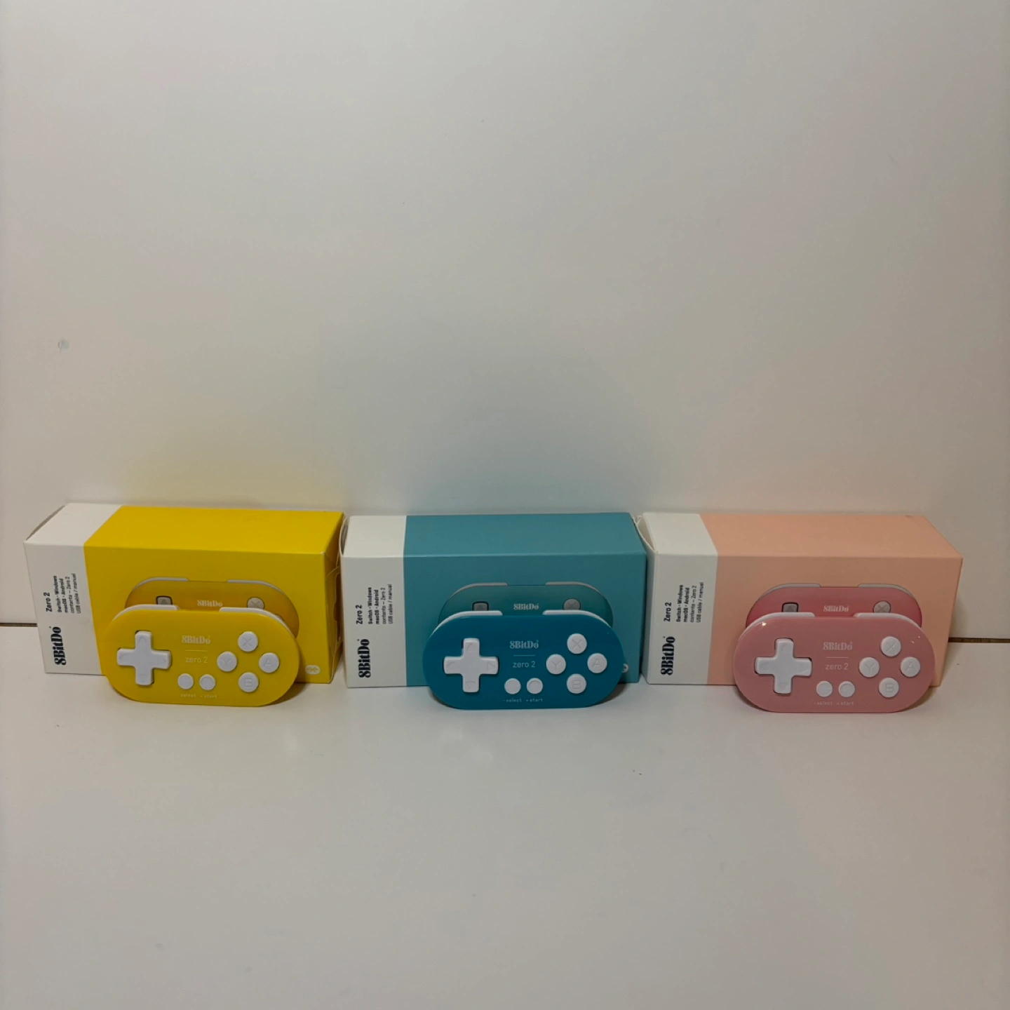 Three 8BitDo Zero 2 Bluetooth Gamepads - Yellow, Teal, Pink | Karrot