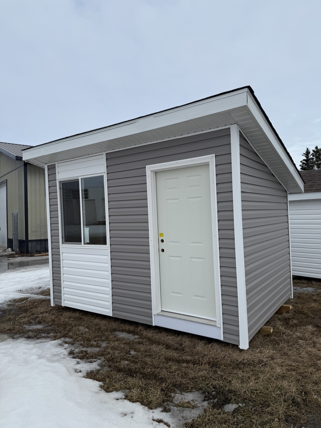 New Gray Shed with White Trim