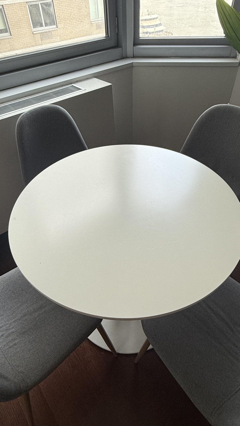 Round White Dining Table with Four Grey Fabric Chairs - photo 3