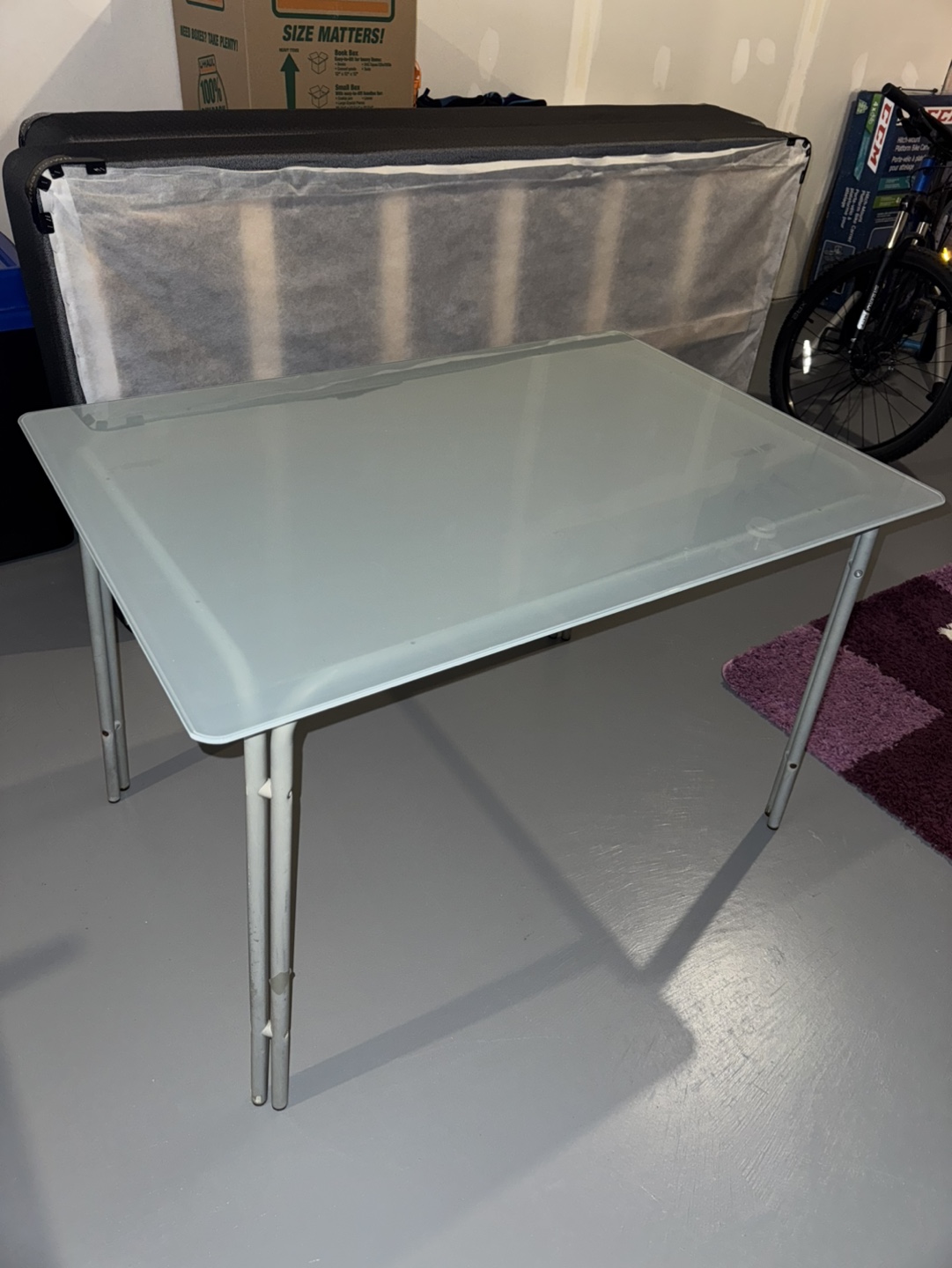 Glass-top metal table