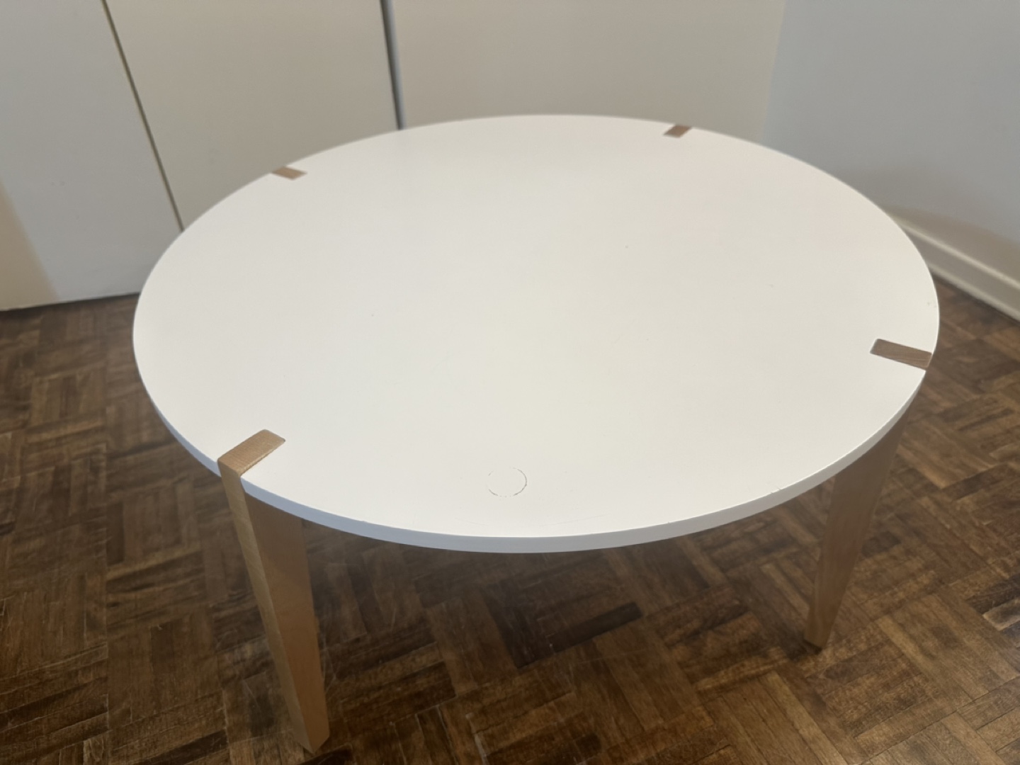 Round White Coffee Table with Light Wood Legs