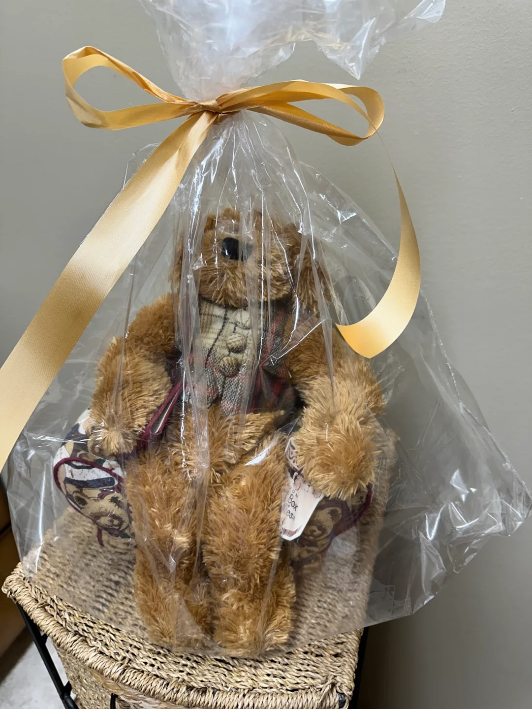 A Harrods Teddy Bear sitting in a small, overstuffed chair image indicator(9)