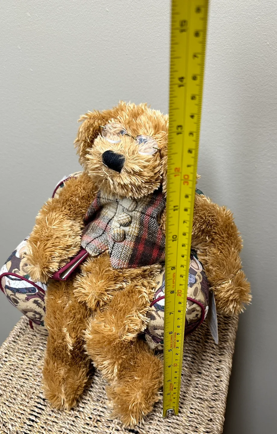 A Harrods Teddy Bear sitting in a small, overstuffed chair image indicator(7)