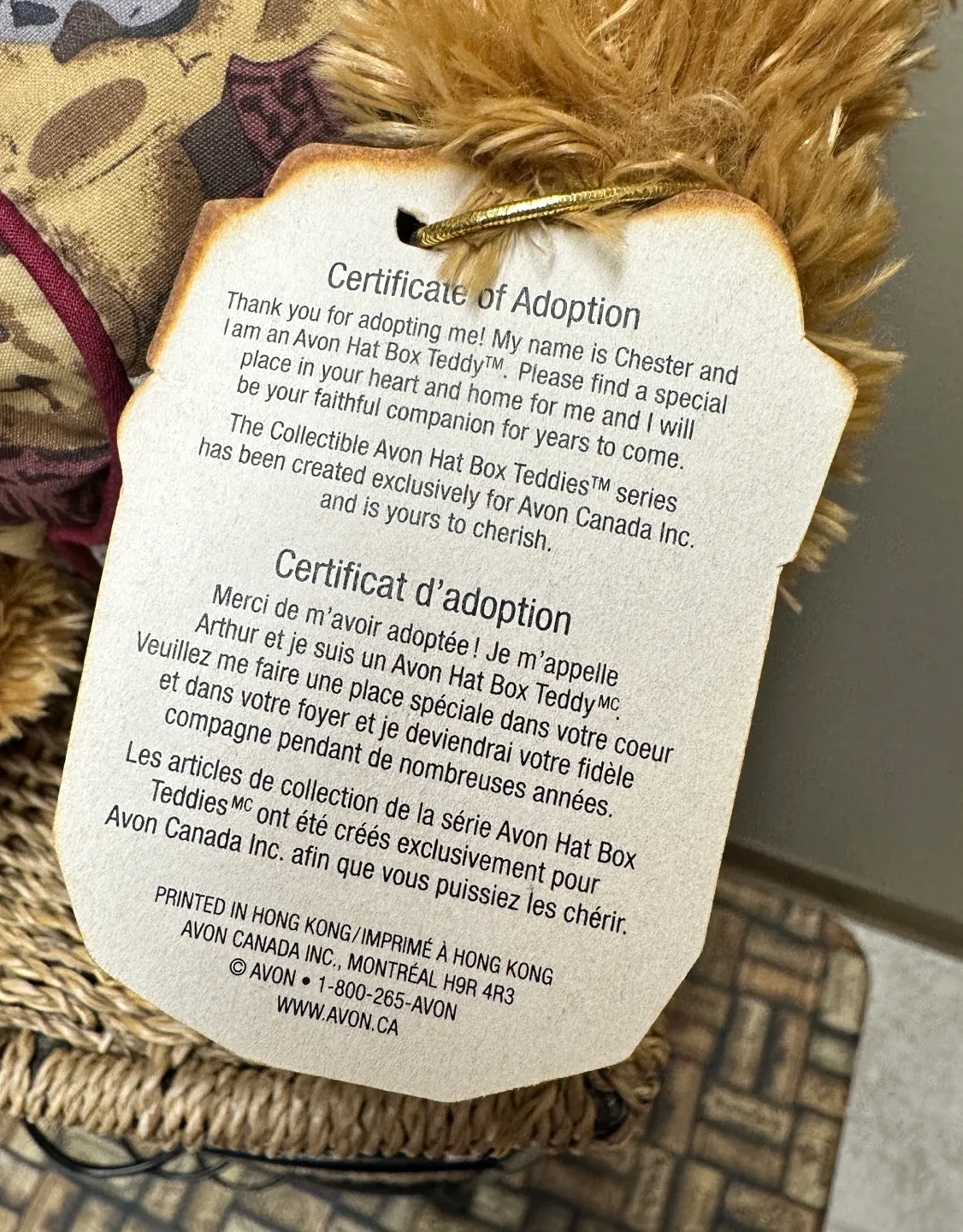 A Harrods Teddy Bear sitting in a small, overstuffed chair image indicator(8)