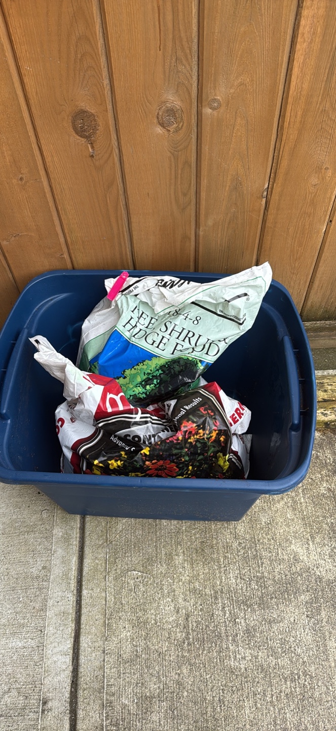Two bags of potting soil and a storage container - photo 2