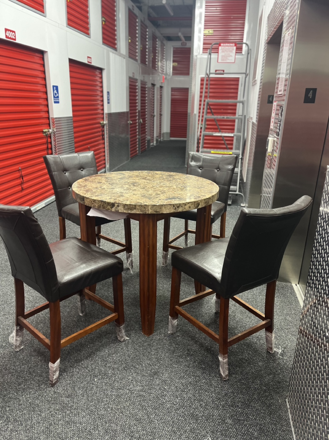 Round Pub Table Set with 4 Brown Leather Chairs