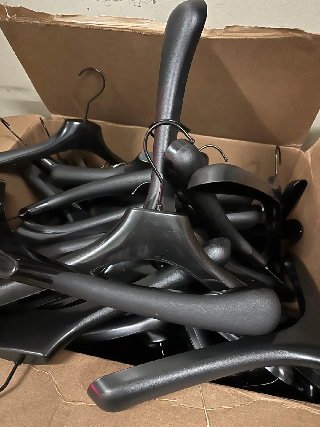 Bulk lot of black plastic hangers image indicator(2)