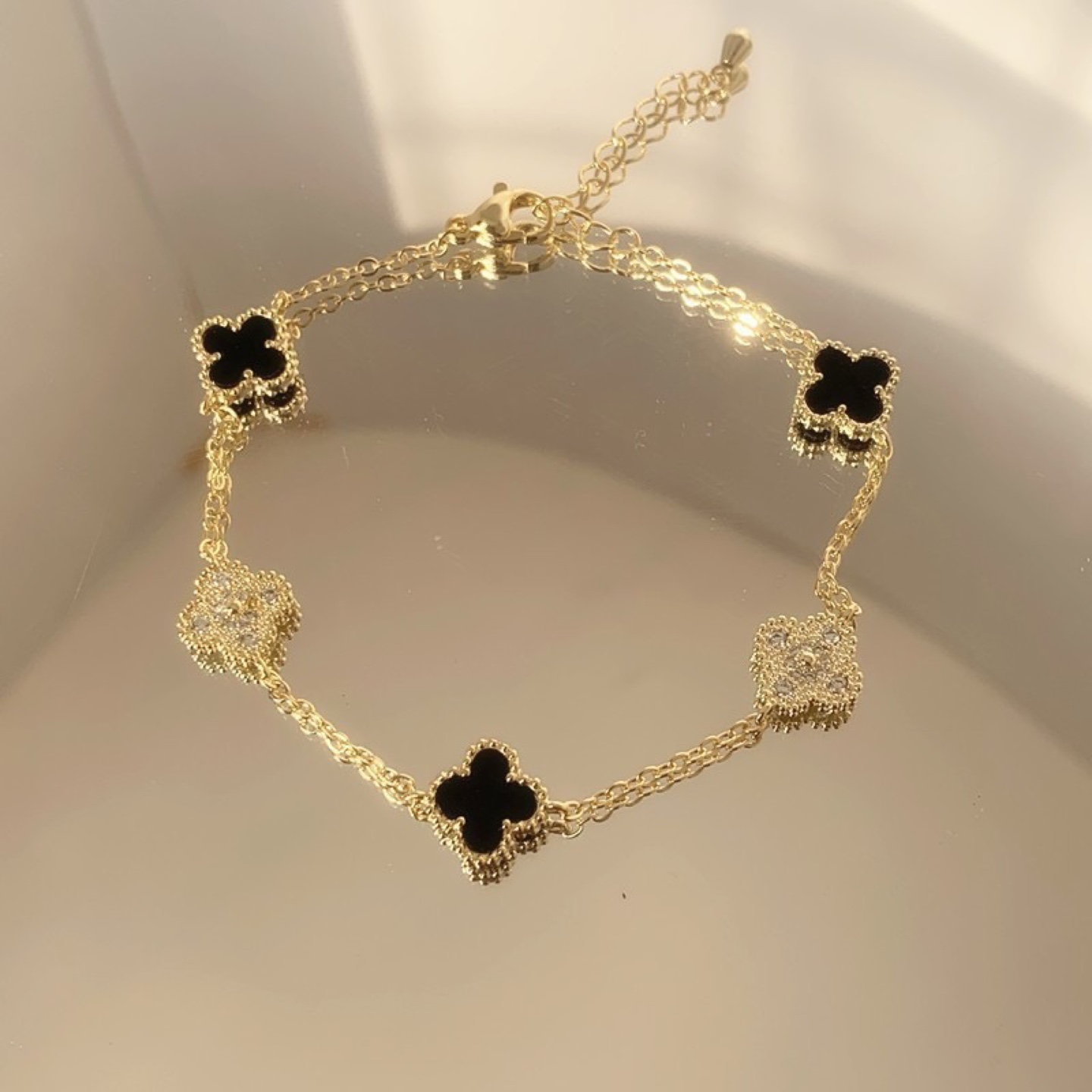 Elegant Gold Plated Bracelet with Black Clover Charms - photo 2
