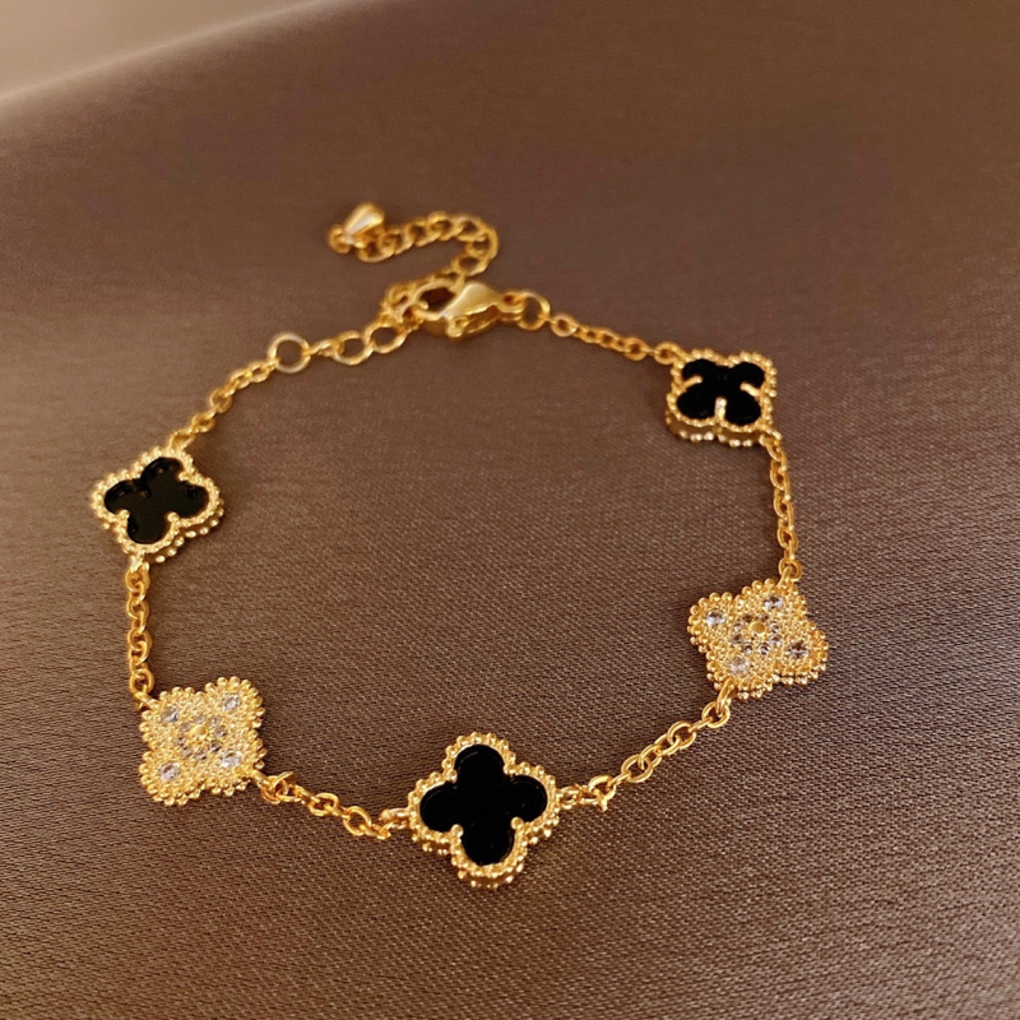 Elegant Gold Plated Bracelet with Black Clover Charms - photo 3