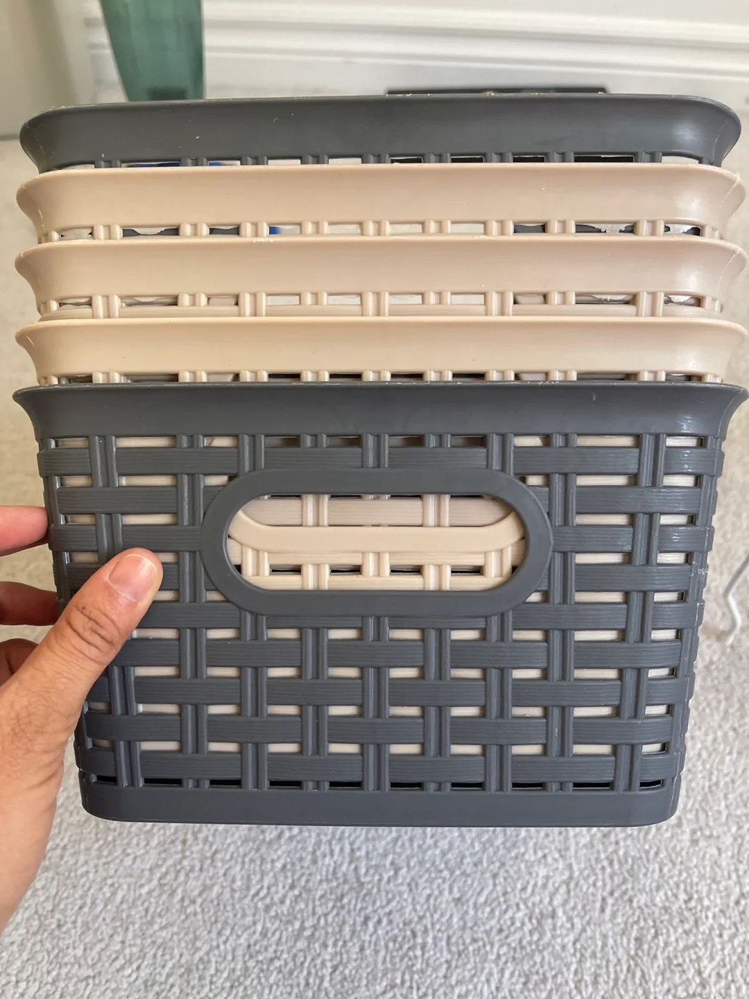 Set of five grey and beige plastic storage baskets image indicator(2)