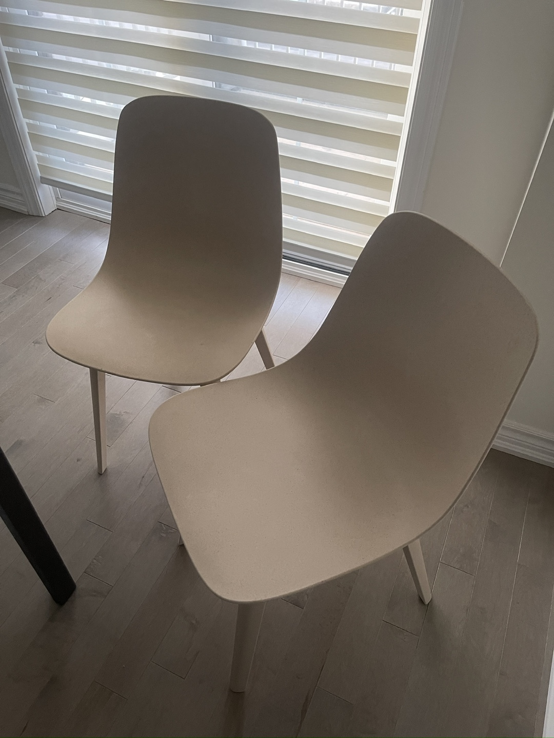 A pair of IKEA ODGER Beige Dining Chairs