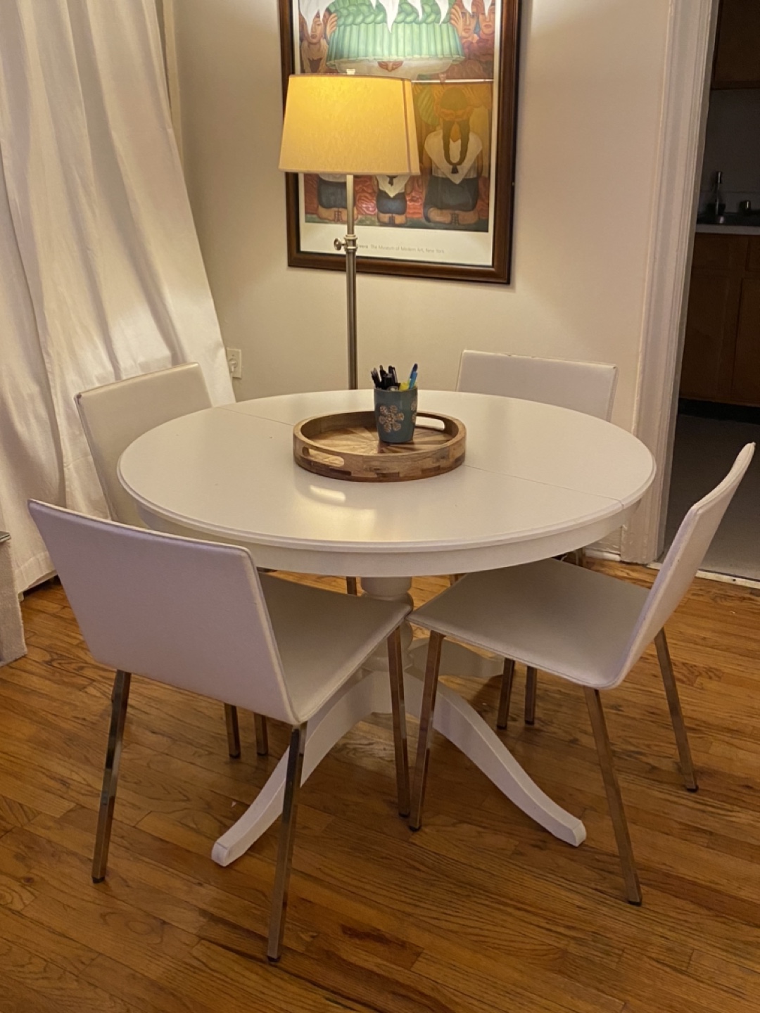 IKEA White extendable dining table with 4 white chairs from CB2