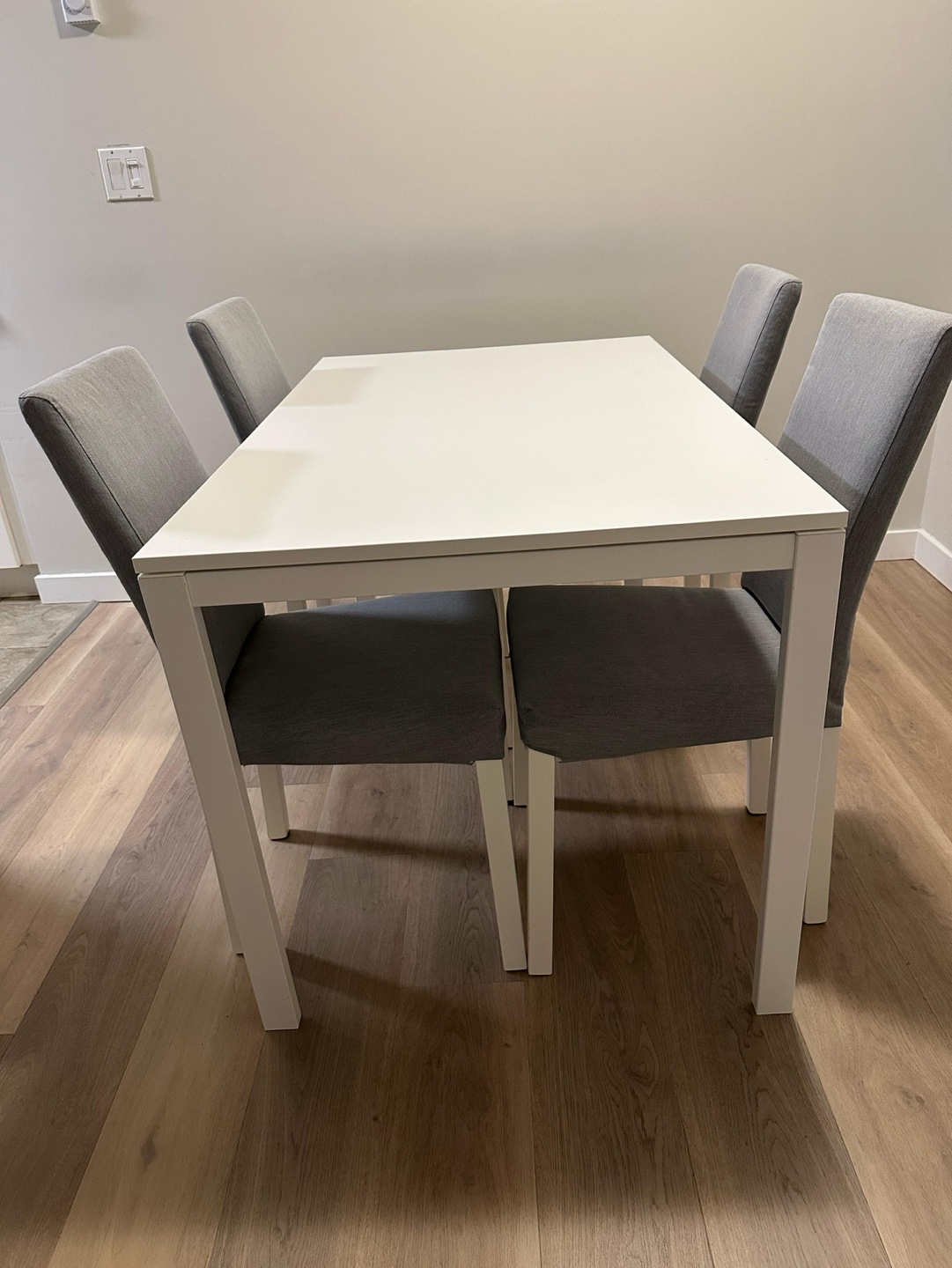IKEA White Dining Table with Four Grey Chairs