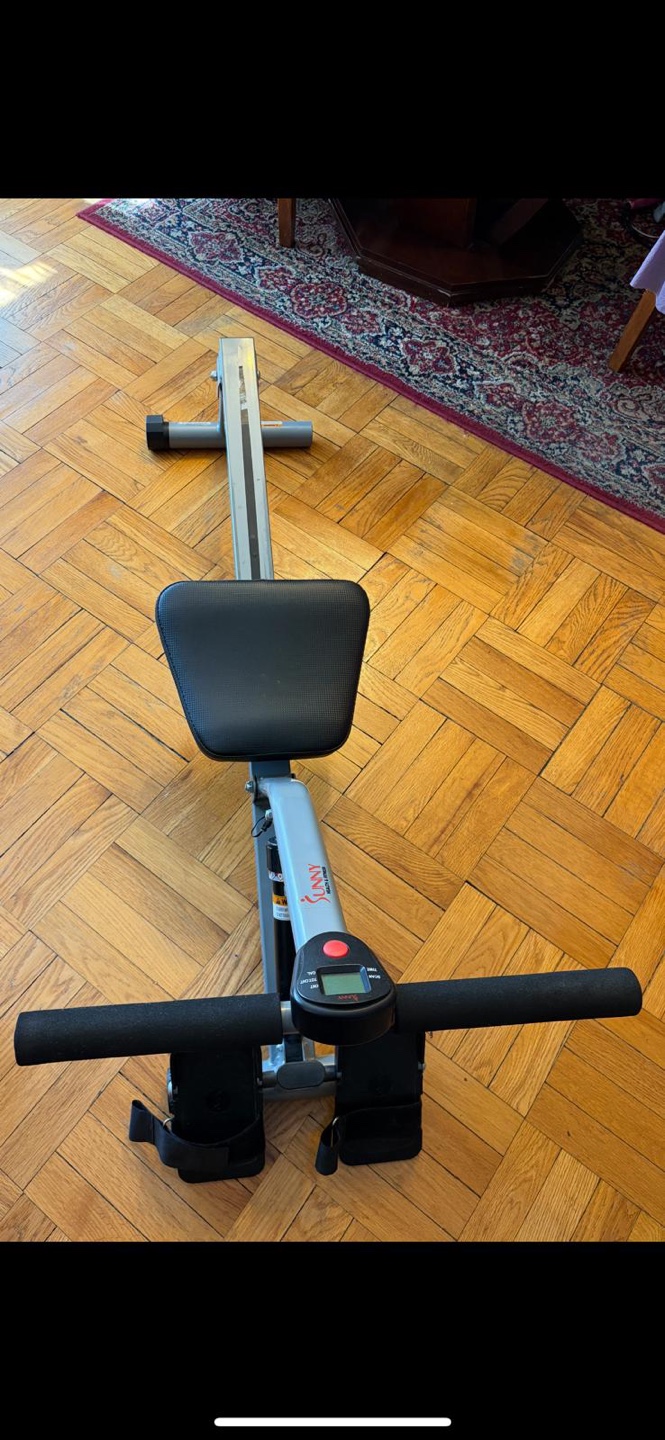 Home rowing fitness machine
