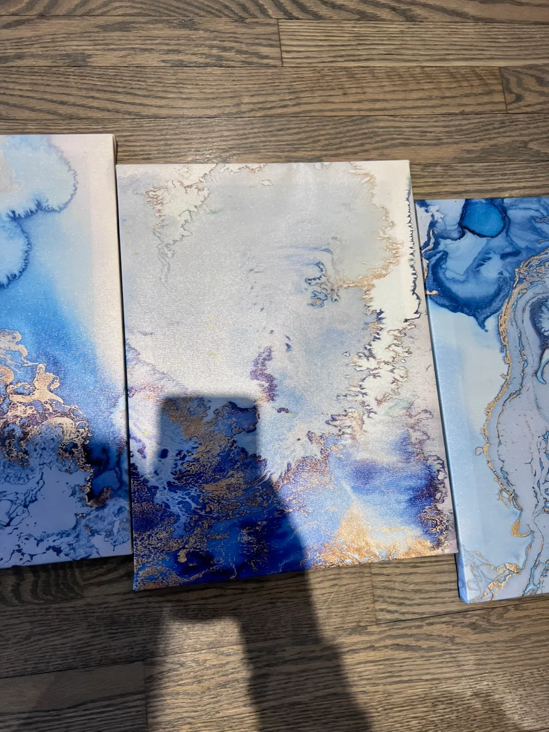 Set of three blue and gold abstract canvas wall art image indicator(3)