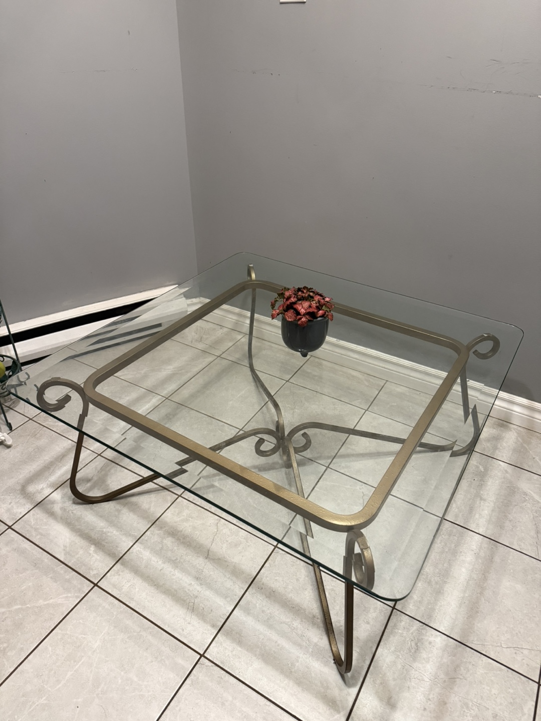 Glass-top Coffee Table with Ornate Metal Frame