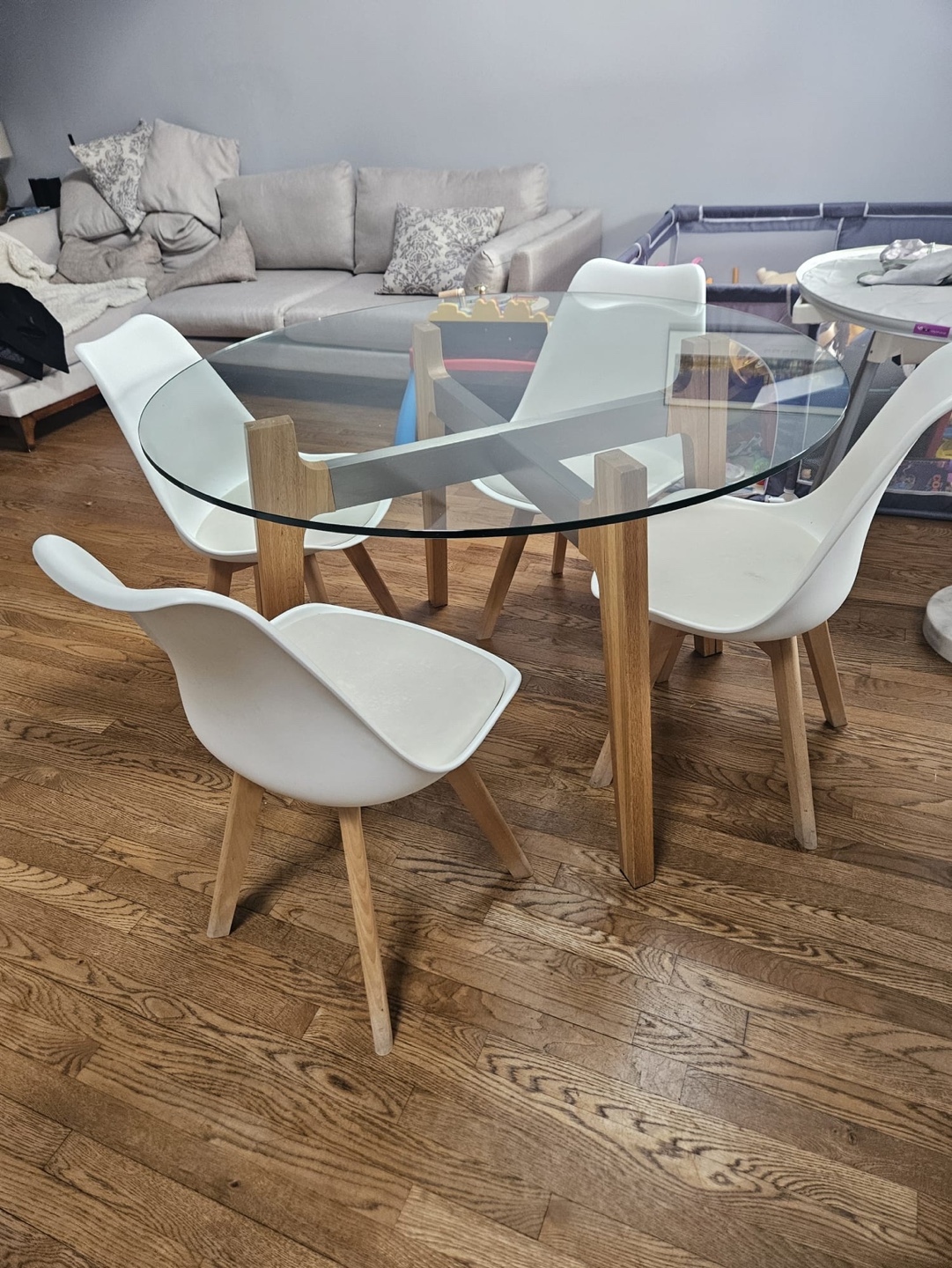 Glass Top Dining Table with Four White Chairs