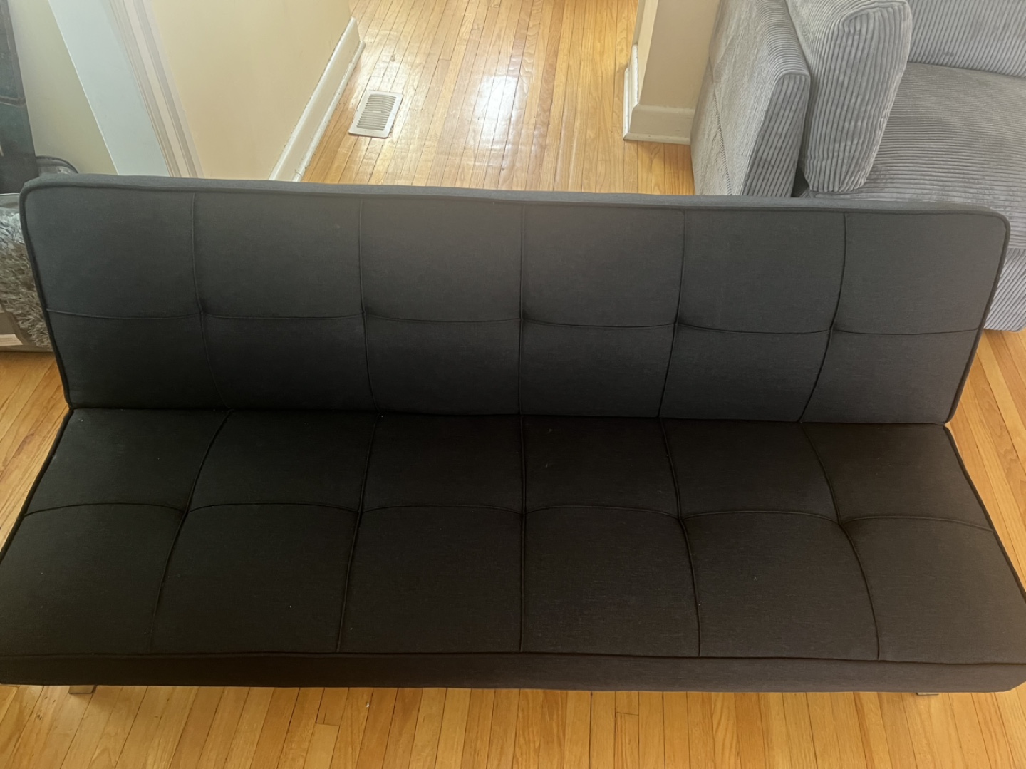Brown Leather Recliner, Black Storage Ottoman, and Black Futon - photo 2