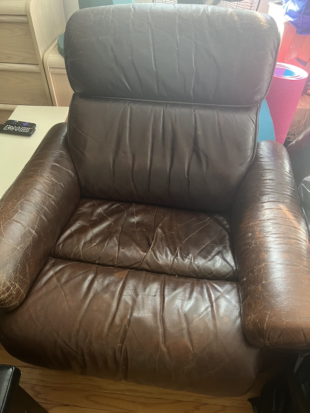 Brown Leather Recliner, Black Storage Ottoman, and Black Futon - photo 3
