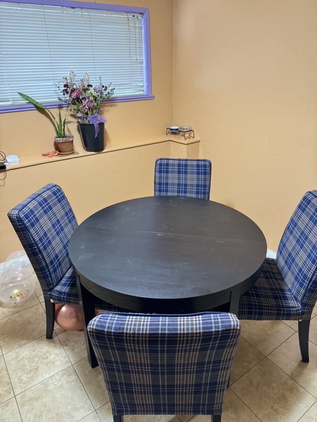 Round dining table with four chairs