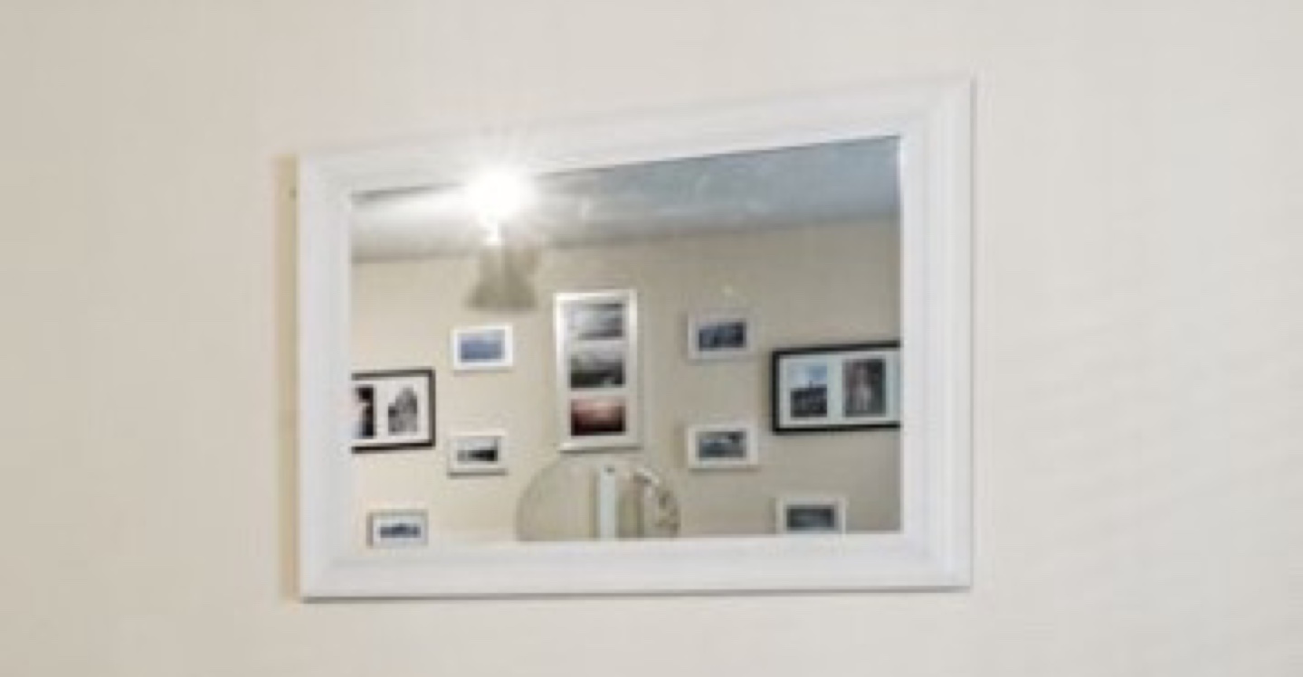 White framed wall mirror