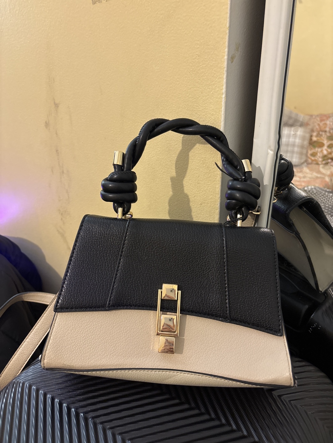 Stylish Two-Tone Handbag with Unique Twisted Handle