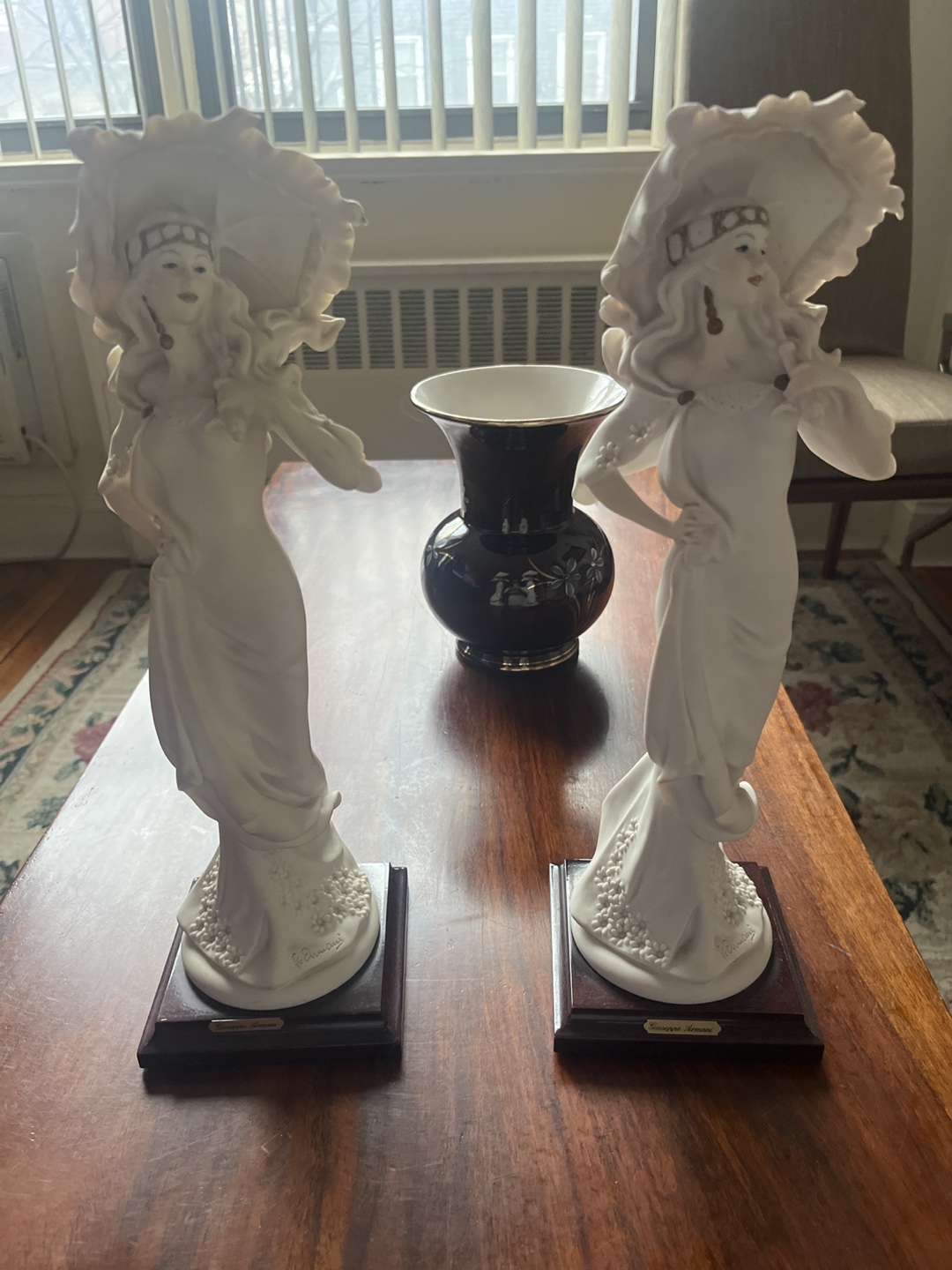 Pair of Guisppe Armani Figurines