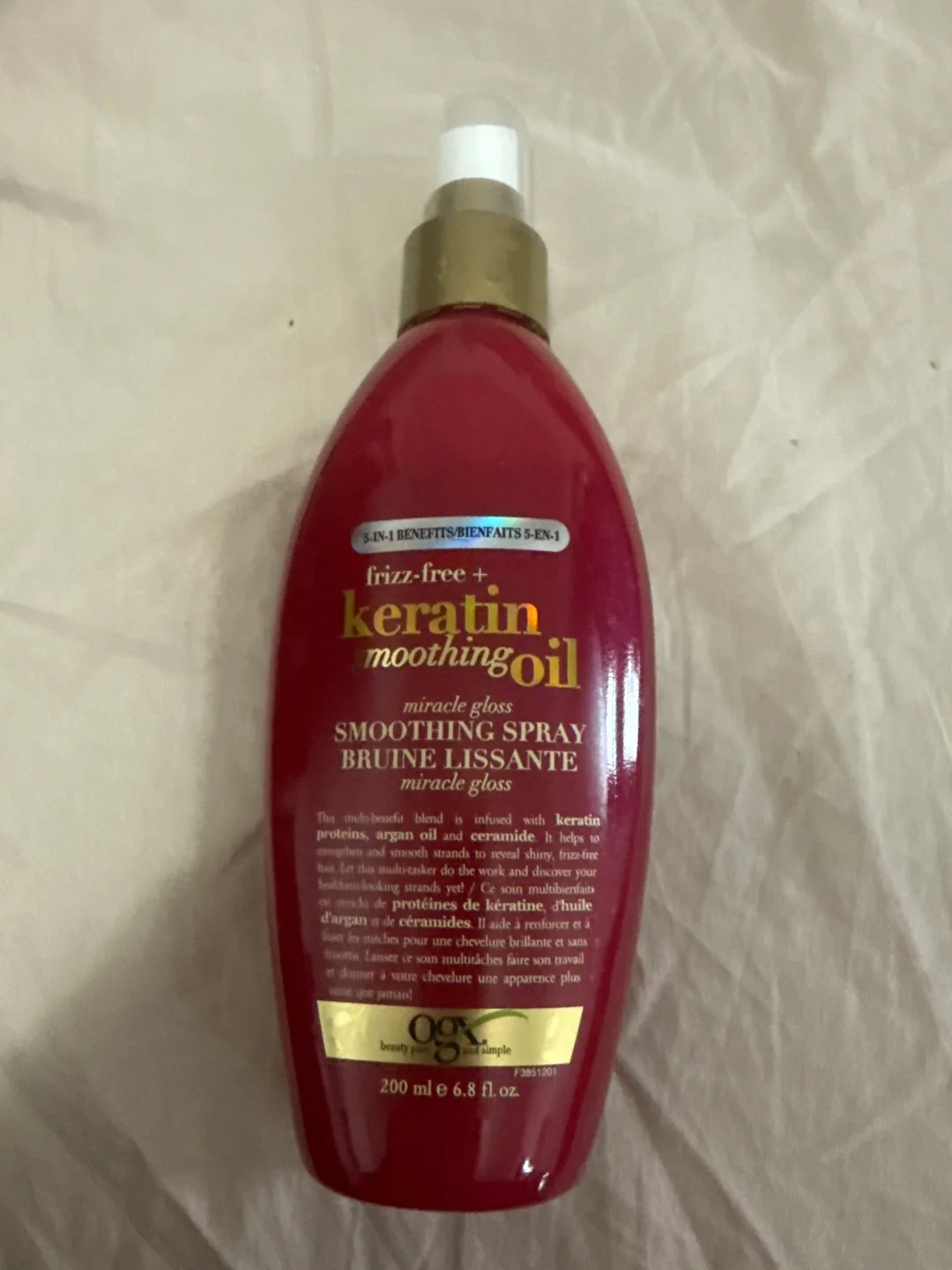 OGX Frizz-Free Keratin + Smoothing Oil Smoothing Spray thumbnail