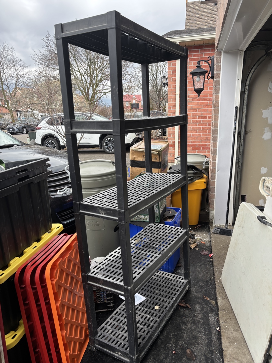 Heavy-duty black plastic shelving unit