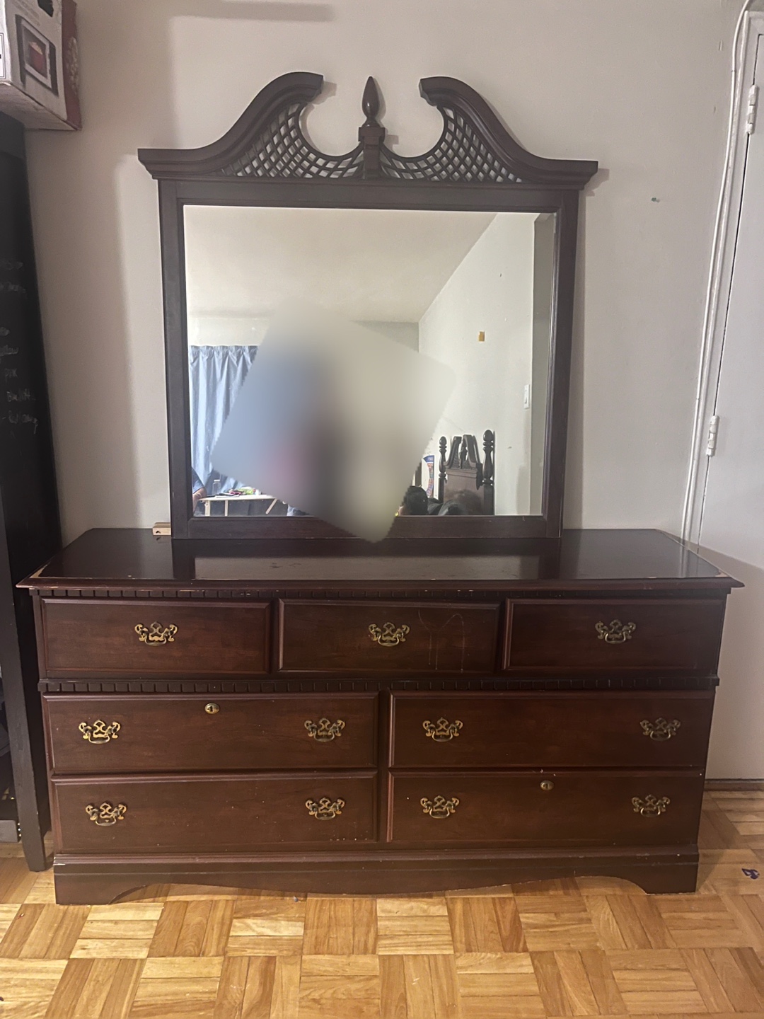 Dark brown wooden dresser with mirror