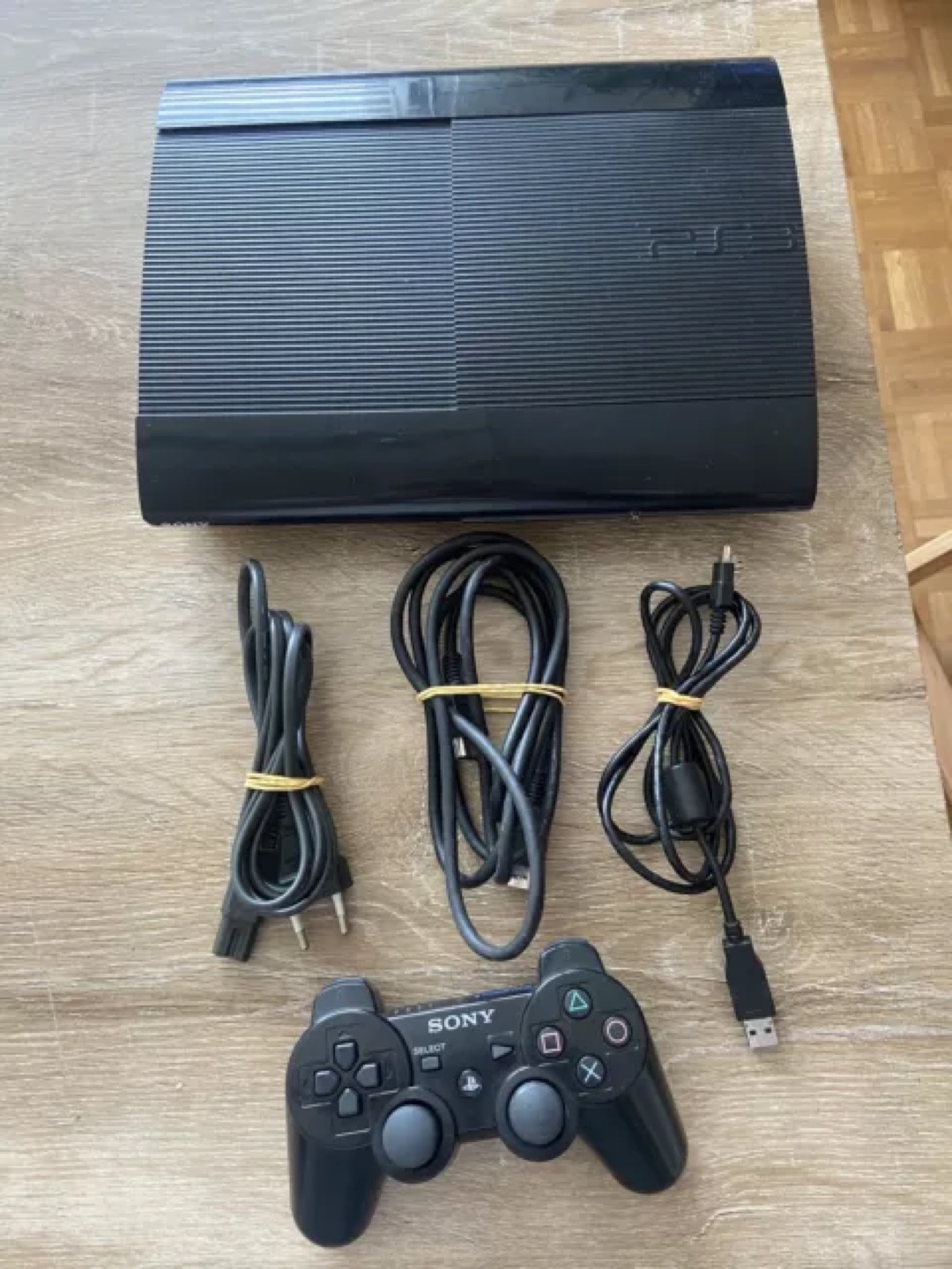 Sony PS3 Super Slim with Controller and Cables