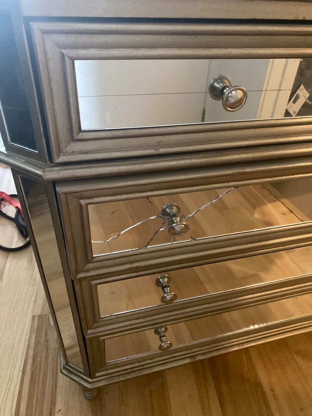 Mirrored five-drawer dresser with crack around handle image indicator(2)