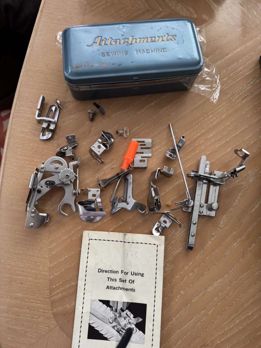 Vintage Sewing Machine Attachments in Tin