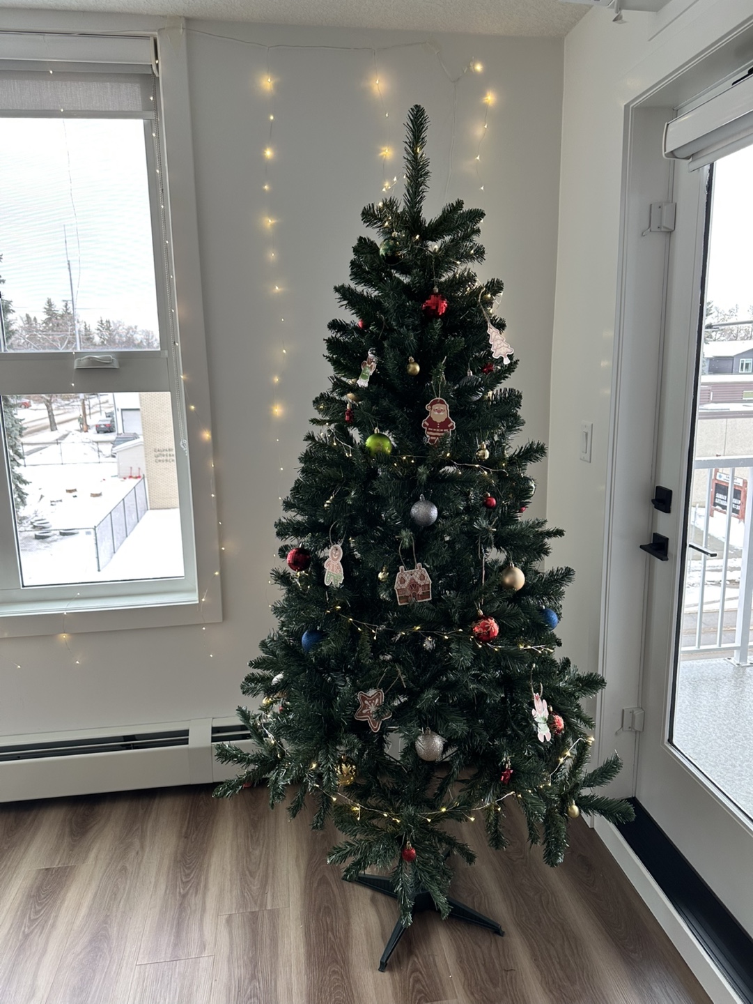 Christmas tree with ornaments and a string of lights like NEW