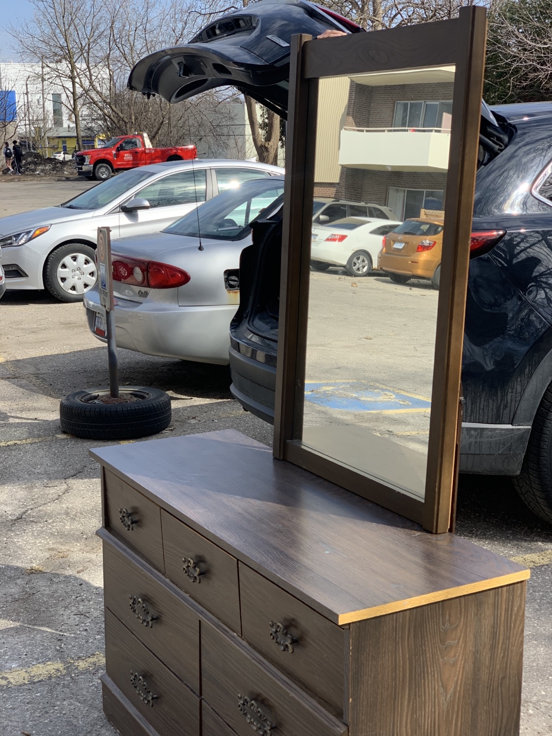 Dark brown dresser with mirror