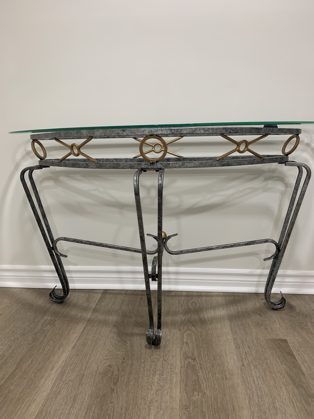 Elegant Glass-Top Console Table with Ornate Metal Frame