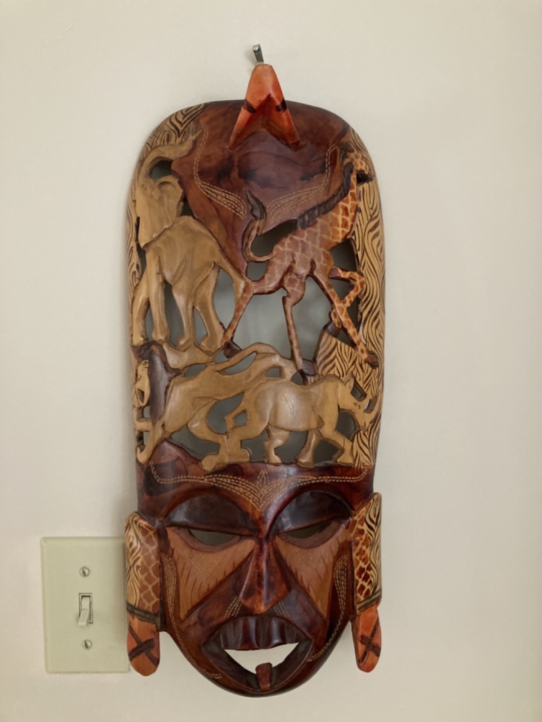Hand-carved African Mask with Wildlife Detail