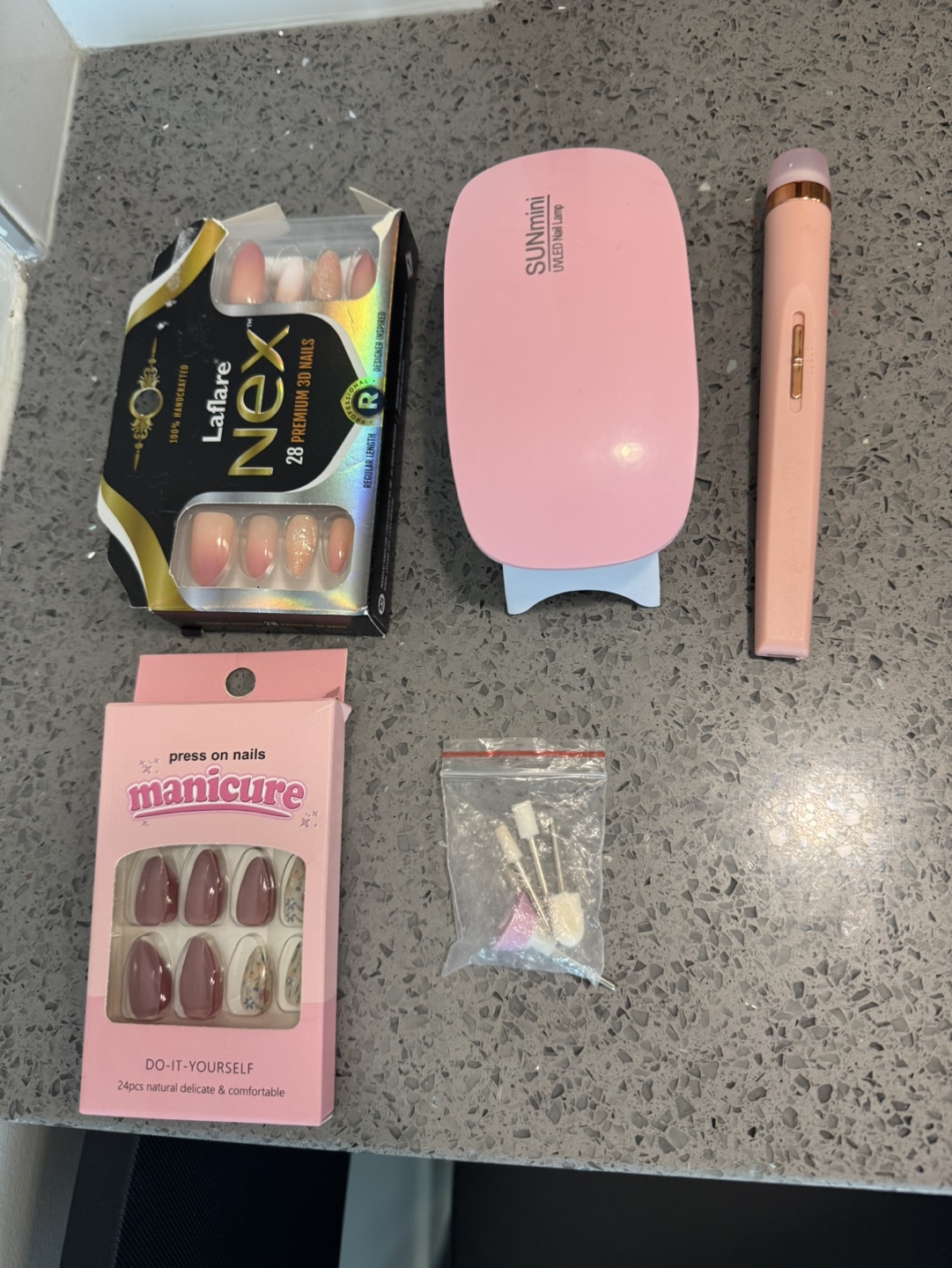 Nail kit bundle: press-on nails, UV lamp, glue, and tools