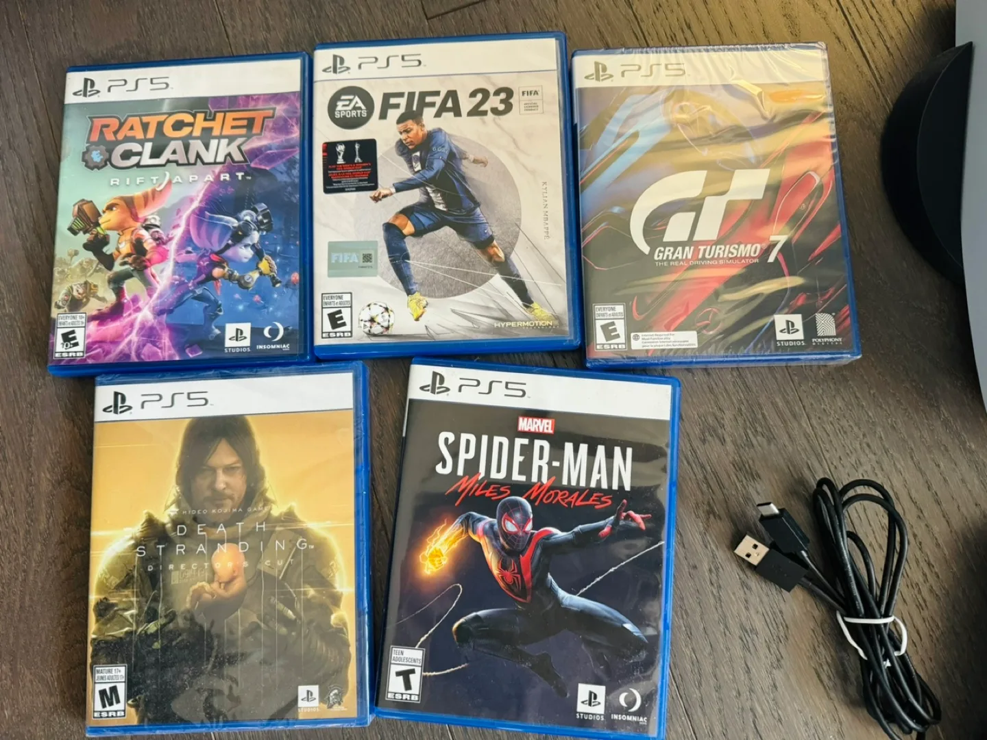 PS5 Console with 5 Games and Accessories image indicator(2)