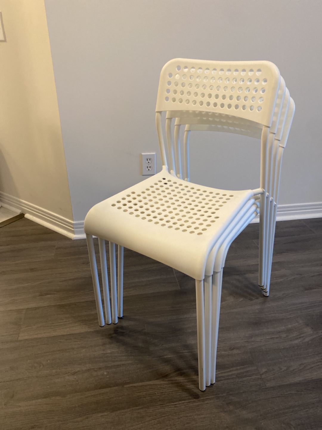 Set of four white IKEA ADDE chairs