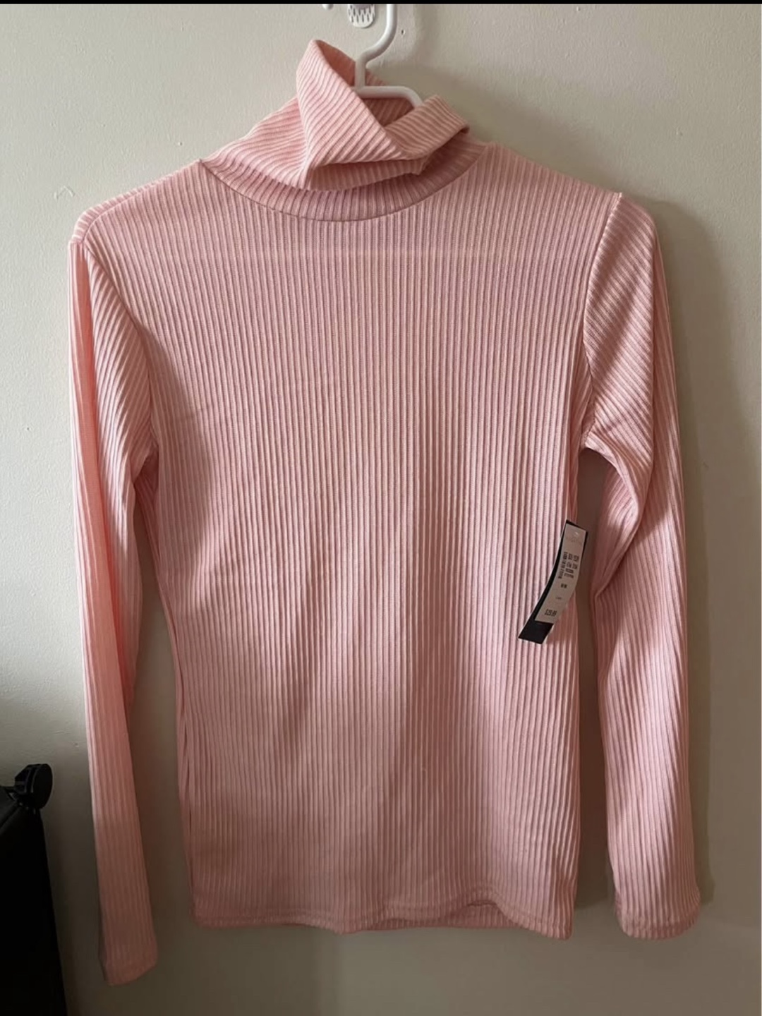 Pink ribbed turtleneck sweater