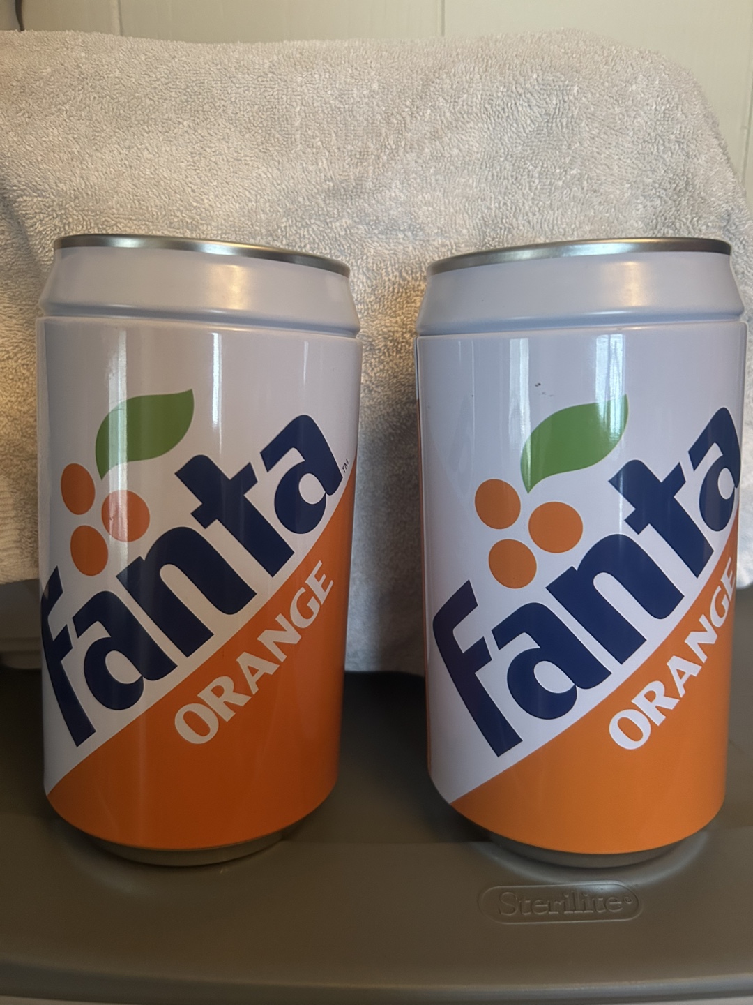 Two Fanta Orange-themed containers